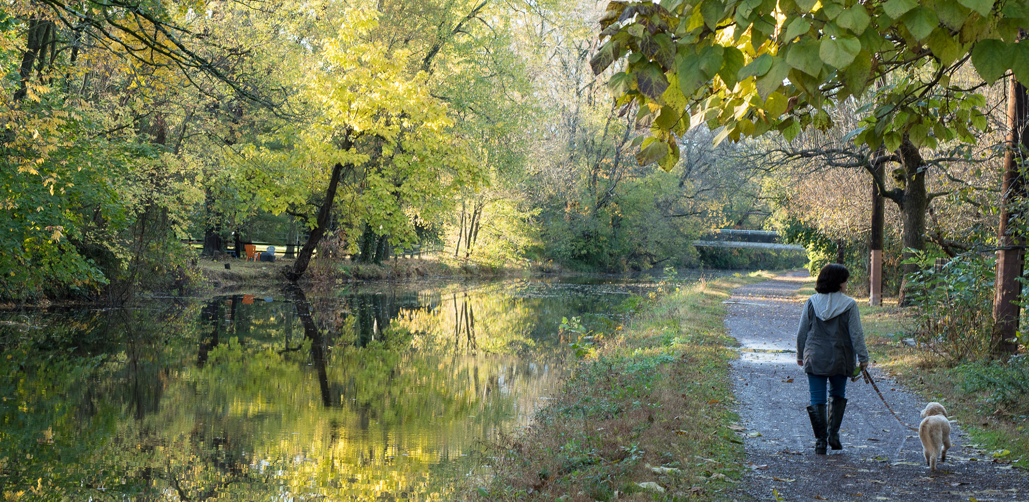 Beautiful walk along the canal of the Delaware River in Bucks County, Pennsylvania, on a sunny morning of October, at the beginning of autumn.